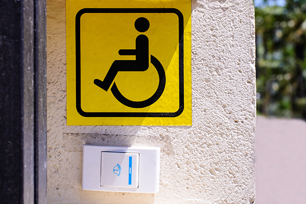 An image of a disability access control door button